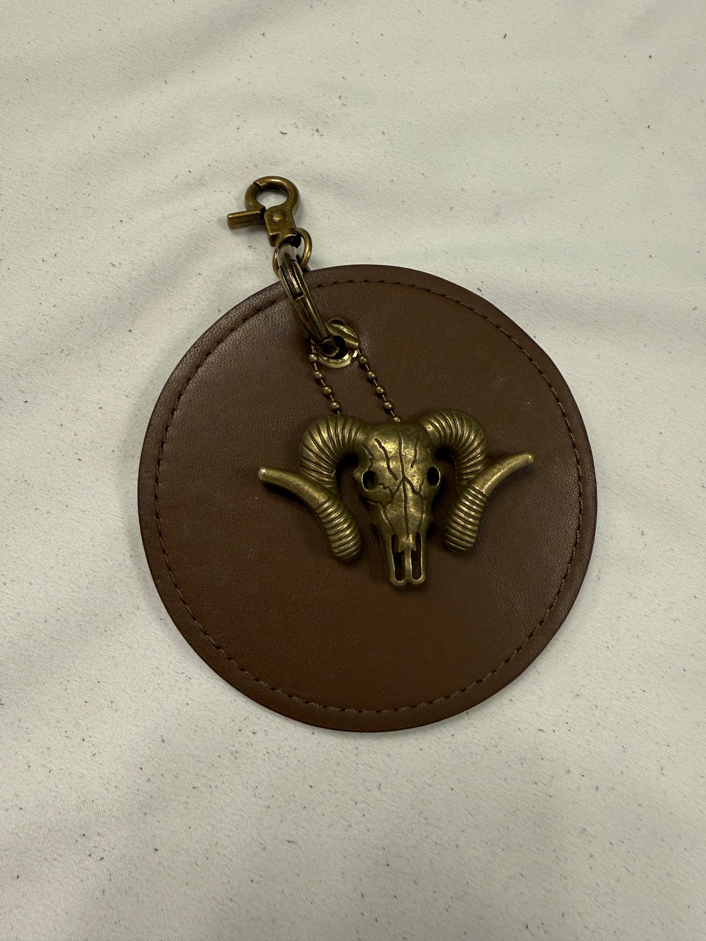 Repurposed 1990s Coach Coaster with Ram Charm- Bag Charm