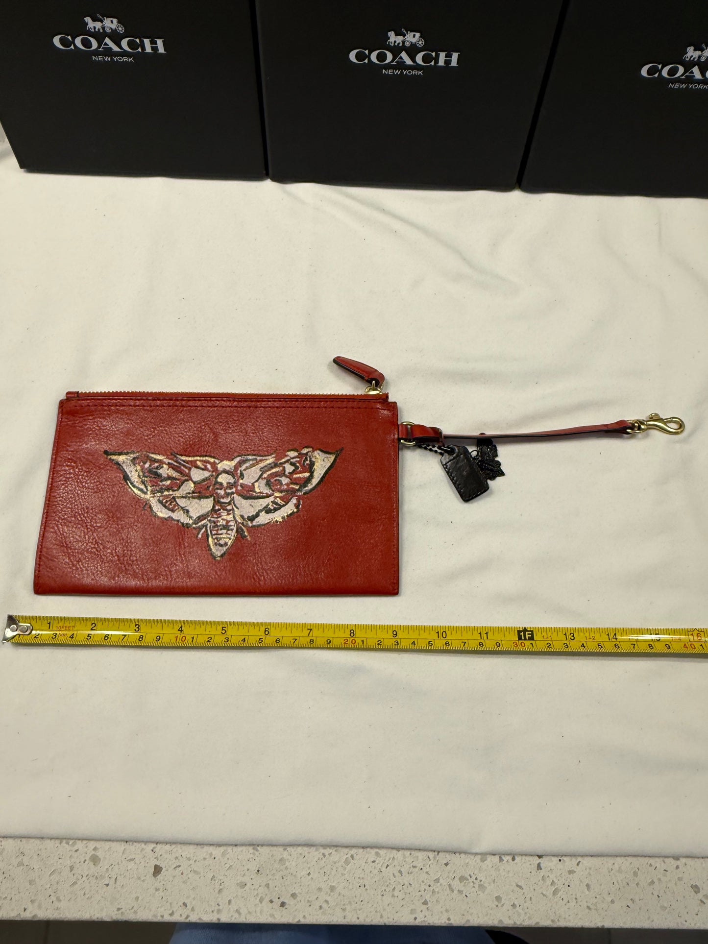Upcrafted Coach Red Back Pouch with Gold Hardware Stenciled Skull Moth Painted and Mini Hagtag and Skull Moth Charm
