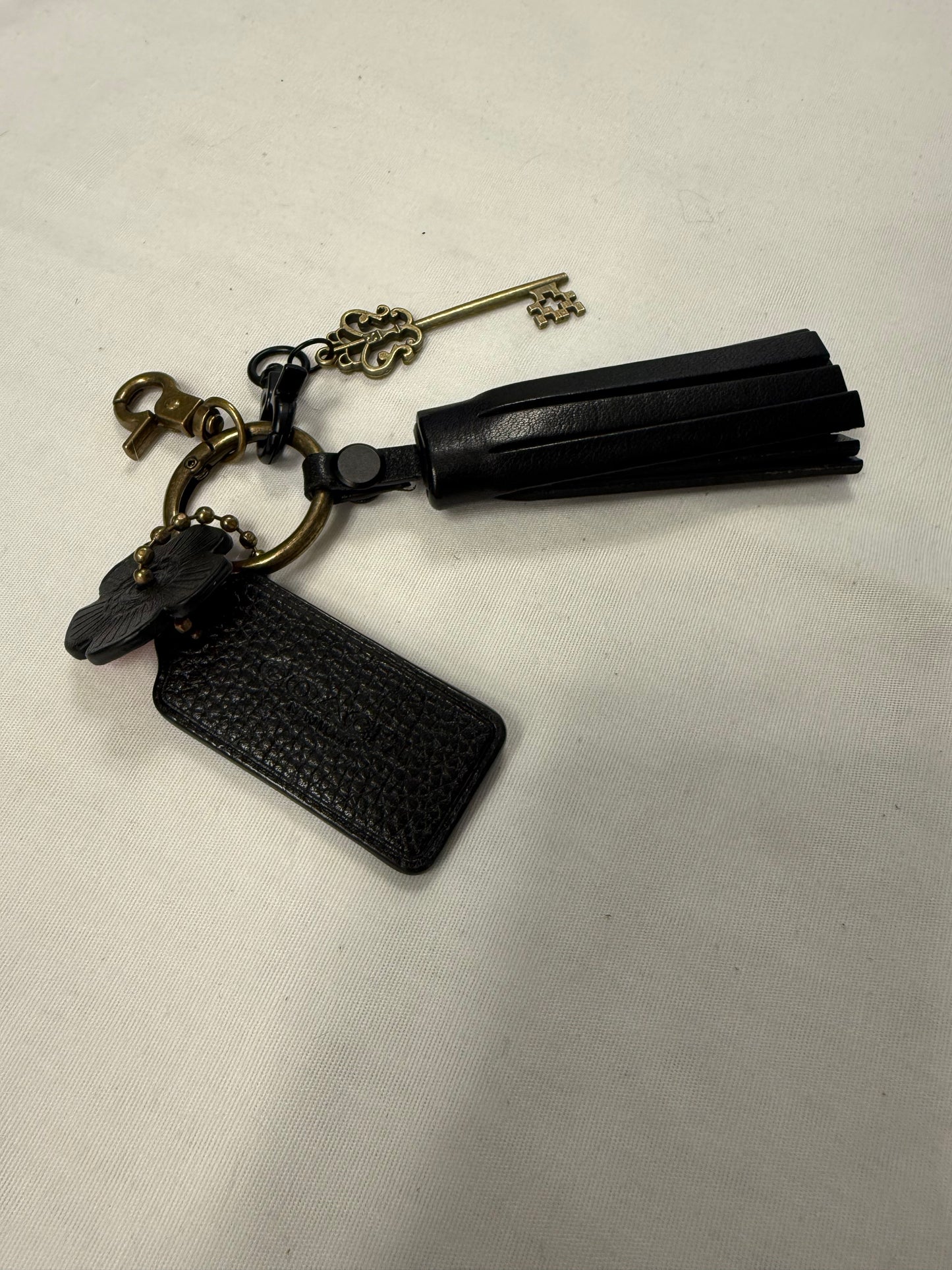 One-of-a-Kind Upcrafted Coach Bag Charm Cluster | Black Leather Tassel, Tea Rose, Hangtag & Key Charm