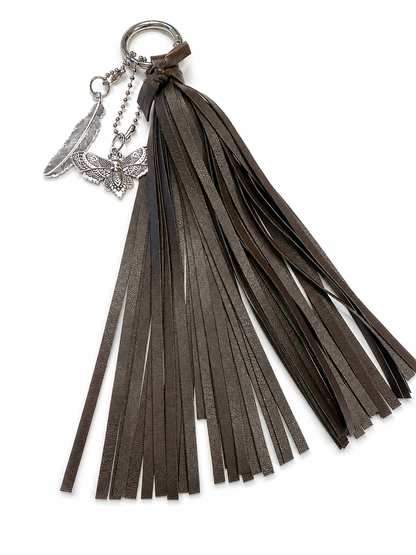 Vegan Leather Handmade Tassel in Dark Maple with Silver Tone Hardware Feather and Skull Moth Bag Charm