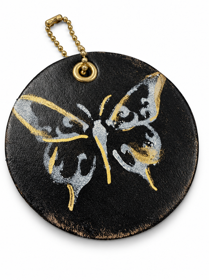 Stenciled and Painted Leather Disc with Butterfly and Skull Moth Charm