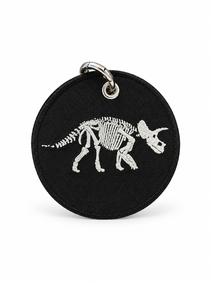 Dinosaur Skeleton Patch on a Piece of Repurposed Coach Handbag Bag Charm