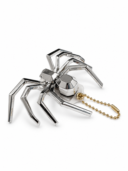 Repurposed Coach Clear (Yellowed) Hangtag with Metallic Plastic Spider Emblem