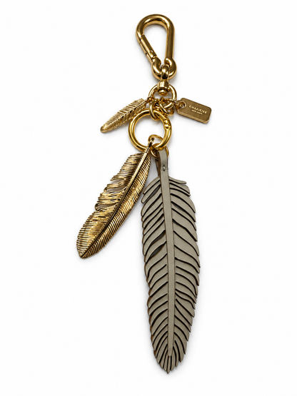 Repurposed Coach Feather and Two Gold Tone Feather Charms on a Coach Clasp