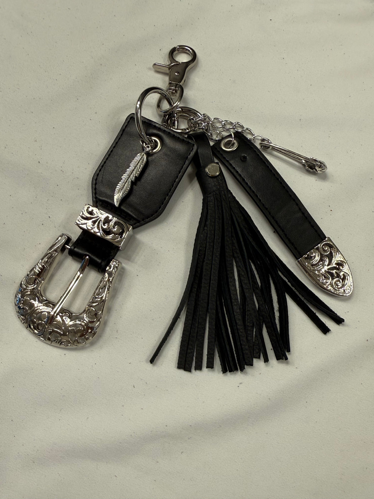 Repurposed Western Belt with Feather Charm and Skull Charm with Handmade Leather Tassel
