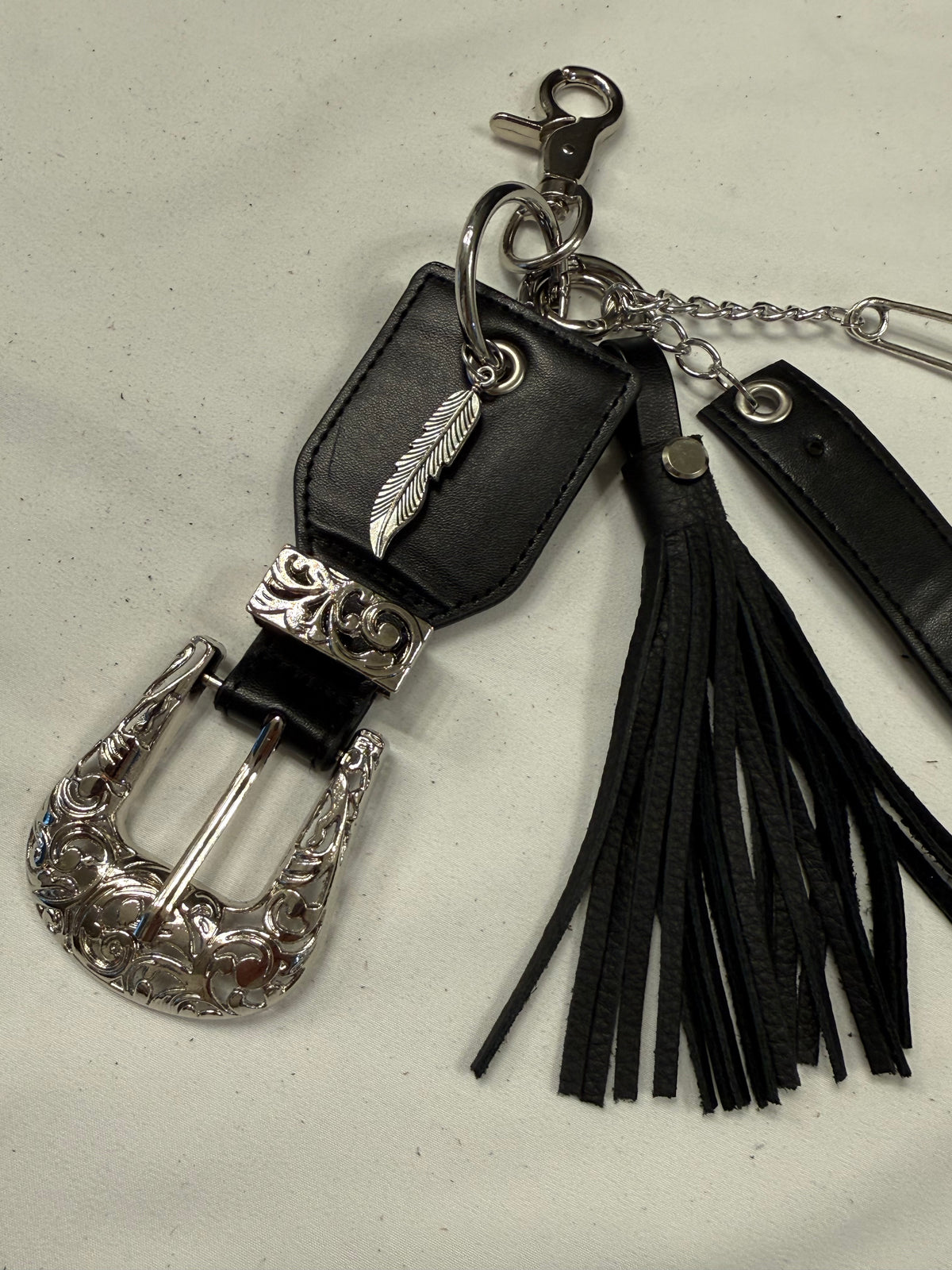 Repurposed Western Belt with Feather Charm and Skull Charm with Handmade Leather Tassel