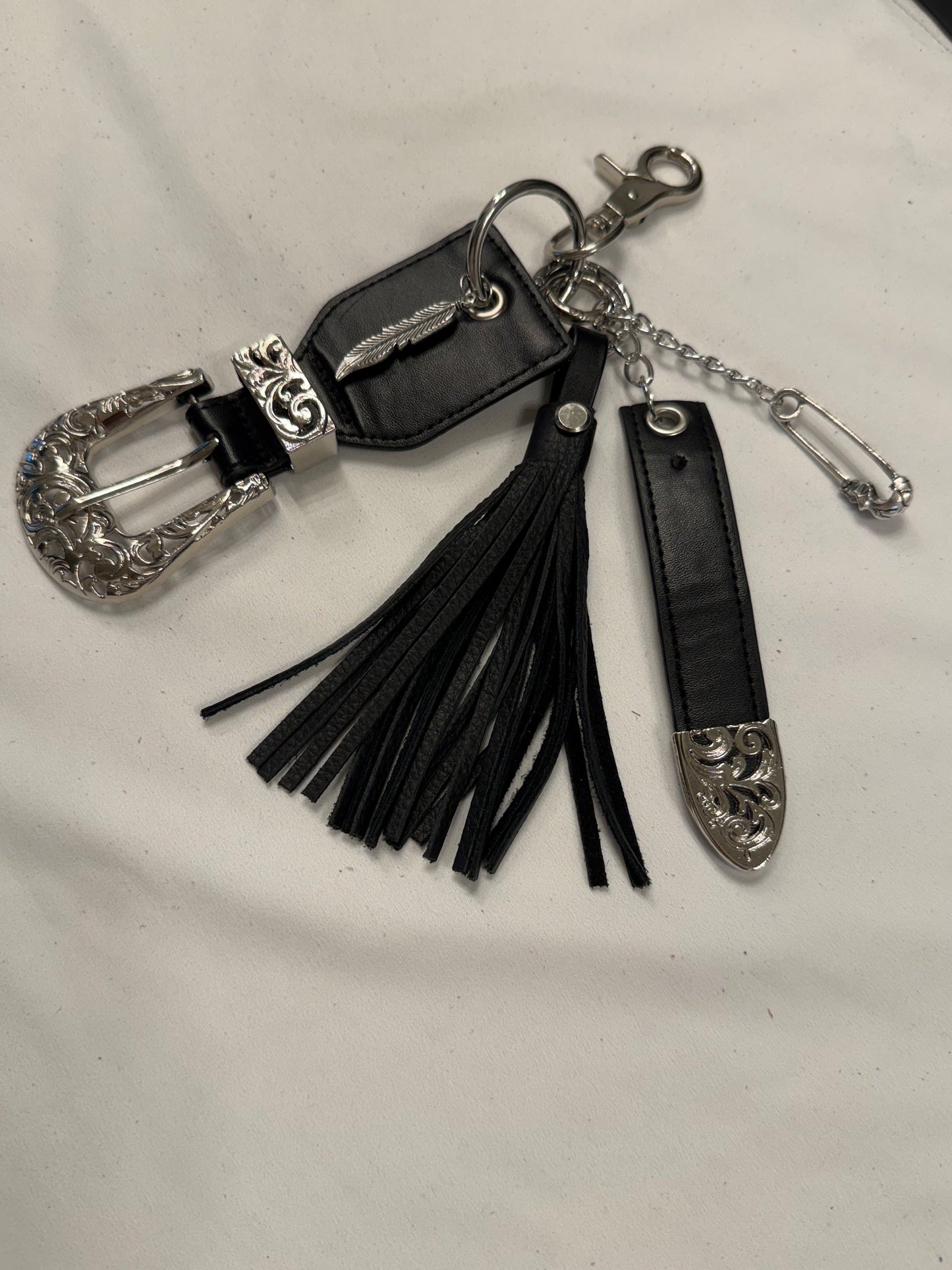 Repurposed Western Belt with Feather Charm and Skull Charm with Handmade Leather Tassel