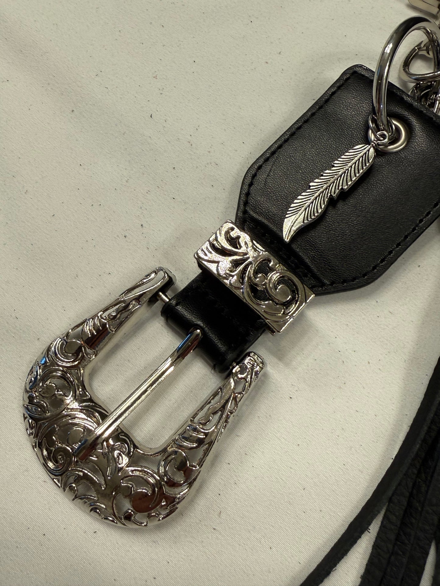 Repurposed Western Belt with Feather Charm and Skull Charm with Handmade Leather Tassel