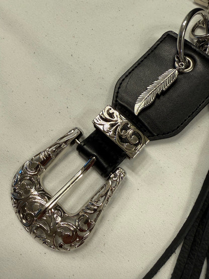 Repurposed Western Belt with Feather Charm and Skull Charm with Handmade Leather Tassel