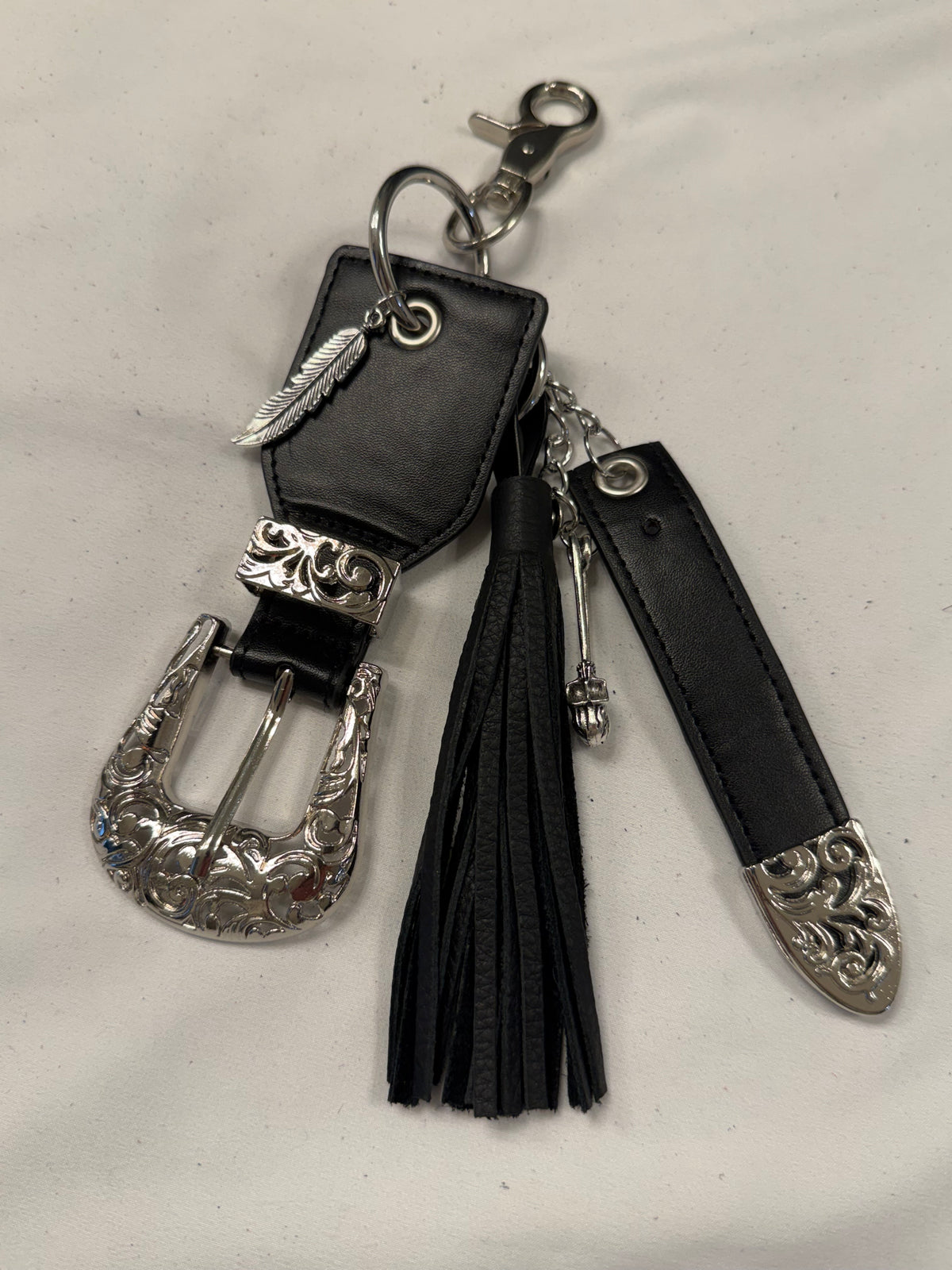 Repurposed Western Belt with Feather Charm and Skull Charm with Handmade Leather Tassel