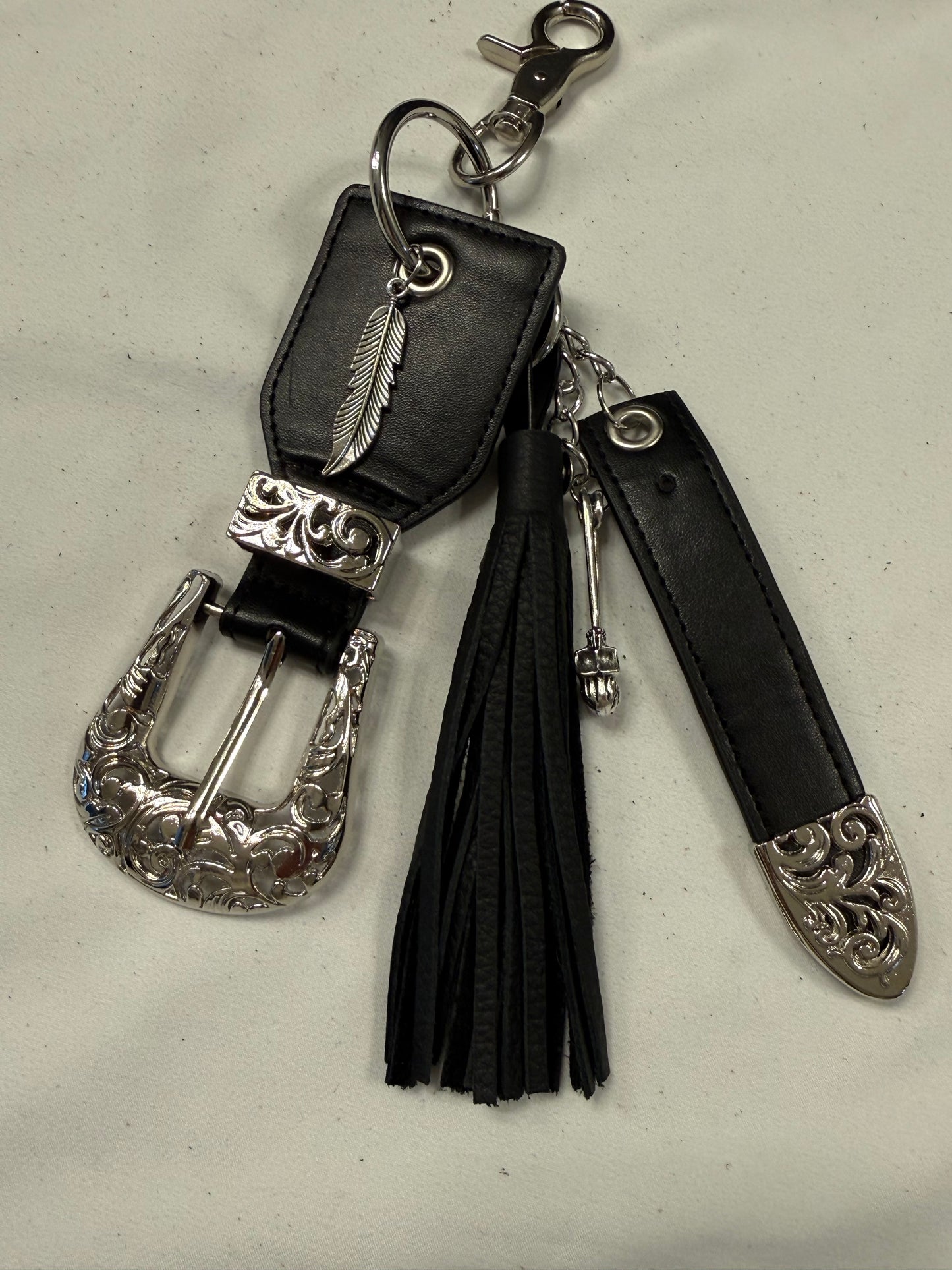 Repurposed Western Belt with Feather Charm and Skull Charm with Handmade Leather Tassel