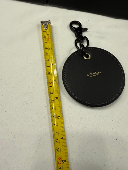 Repurposed Coach Coaster with Distressed Gold Tone Skull Bag Charm