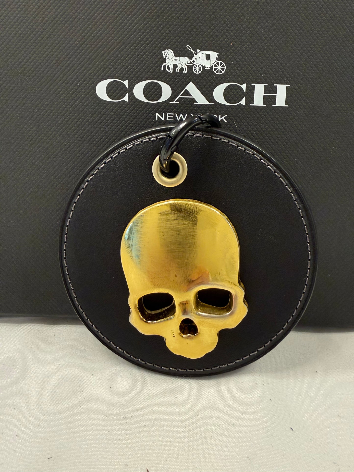 Repurposed Coach Coaster with Distressed Gold Tone Skull Bag Charm