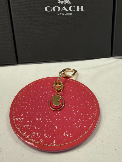 Repurposed Coach 1990s Coaster with a Coach Cameo Charm from a Bracelet