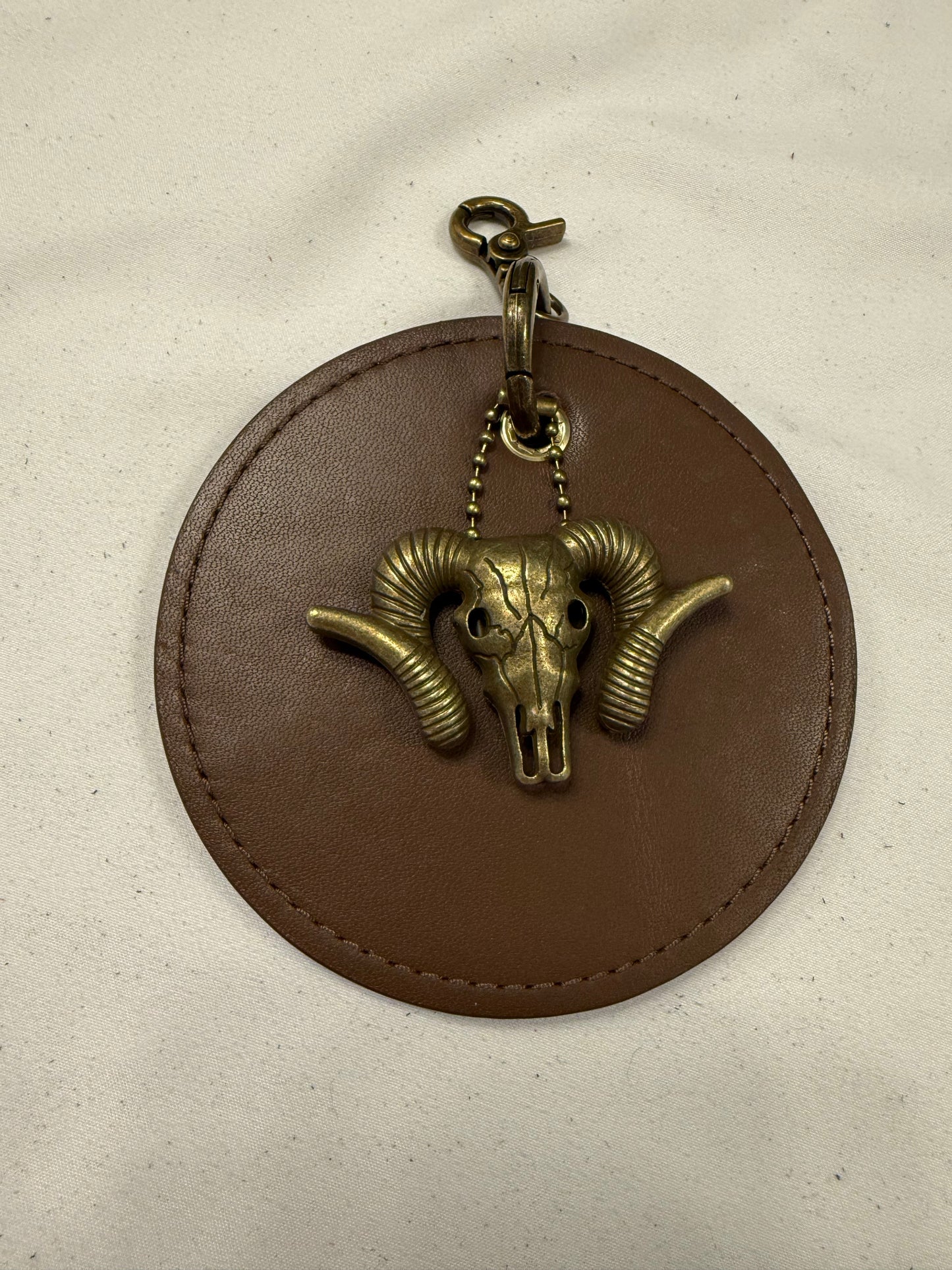 Repurposed 1990s Coach Coaster with Ram Charm- Bag Charm