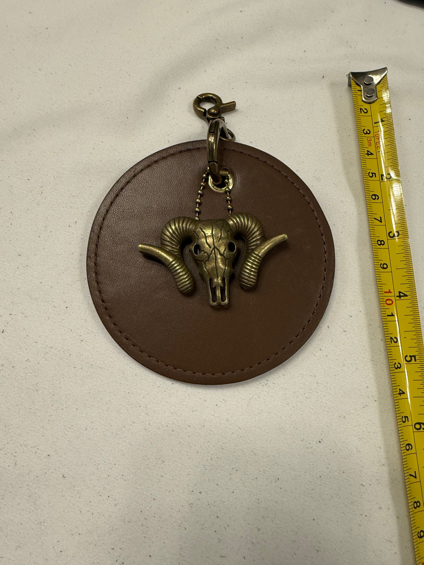 Repurposed 1990s Coach Coaster with Ram Charm- Bag Charm