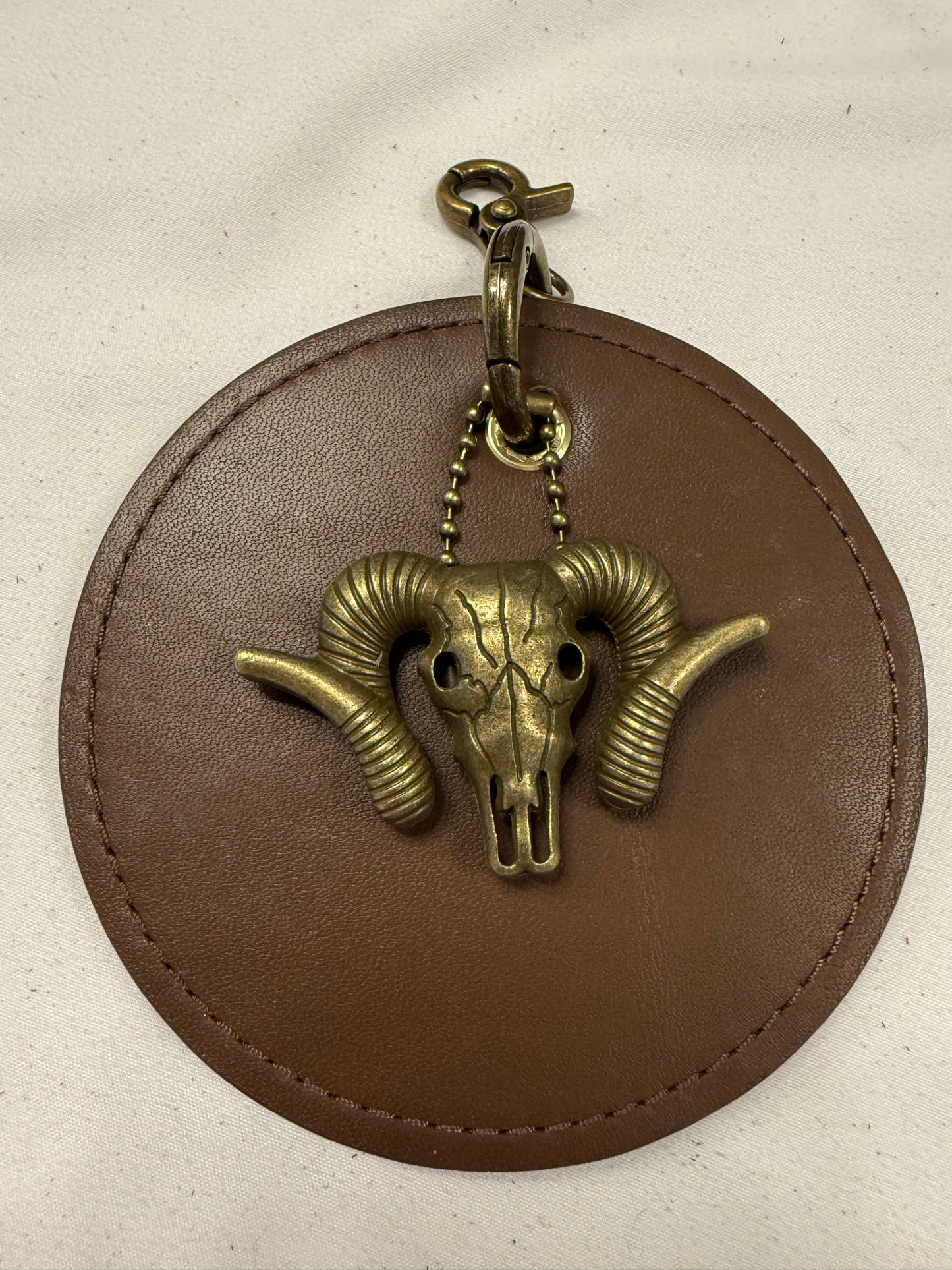 Repurposed 1990s Coach Coaster with Ram Charm- Bag Charm