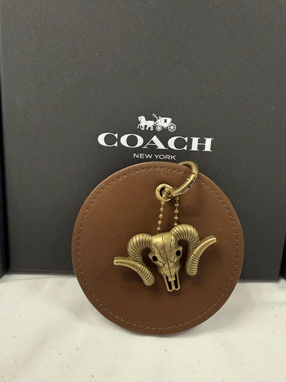 Repurposed 1990s Coach Coaster with Ram Charm- Bag Charm