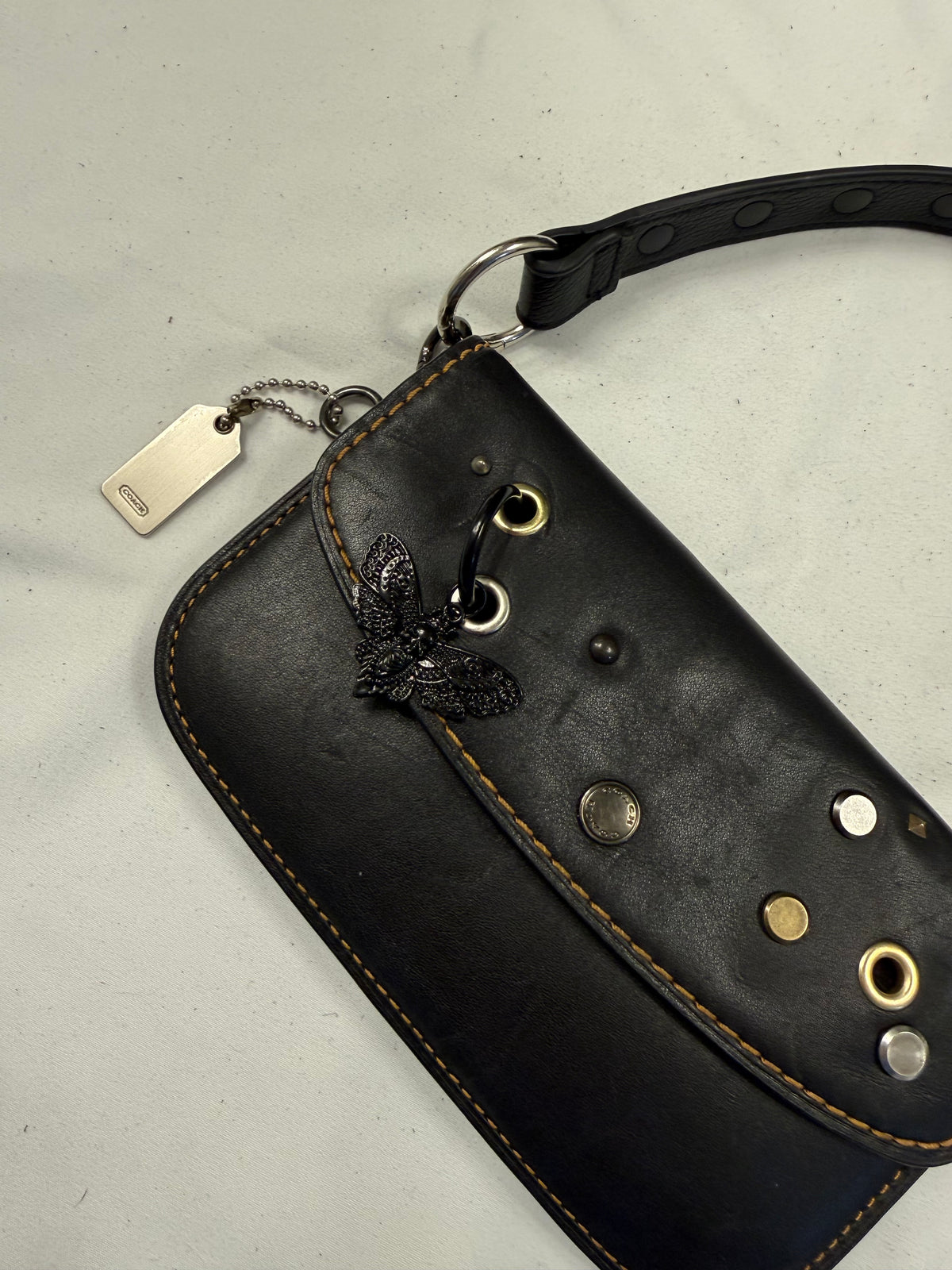 Upcrafted Coach Pouch with Stenciled Skull Moth, Rivets, Studded Handle, and Metal Mini Hangtag