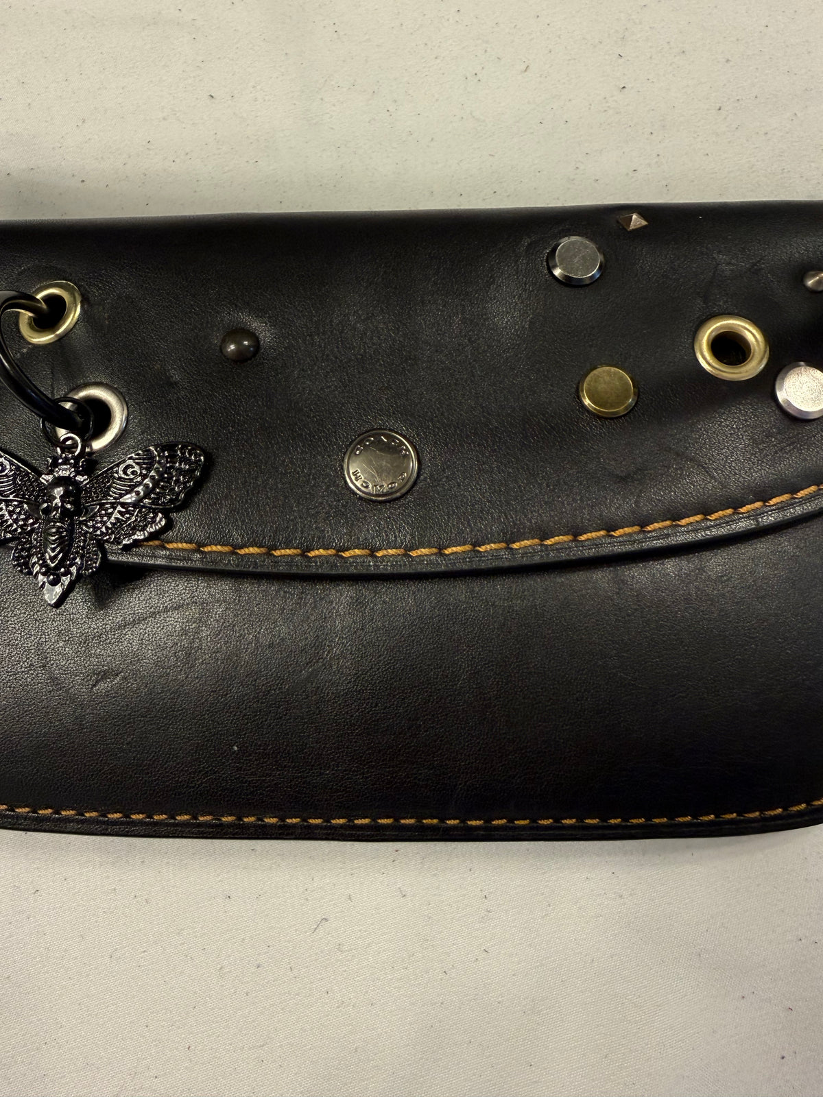 Upcrafted Coach Pouch with Stenciled Skull Moth, Rivets, Studded Handle, and Metal Mini Hangtag