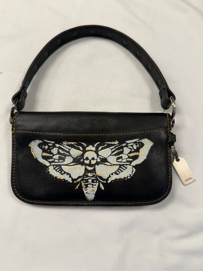 Upcrafted Coach Pouch with Stenciled Skull Moth, Rivets, Studded Handle, and Metal Mini Hangtag