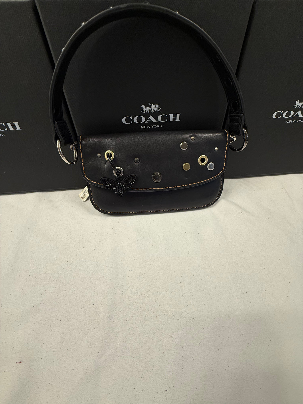 Upcrafted Coach Pouch with Stenciled Skull Moth, Rivets, Studded Handle, and Metal Mini Hangtag