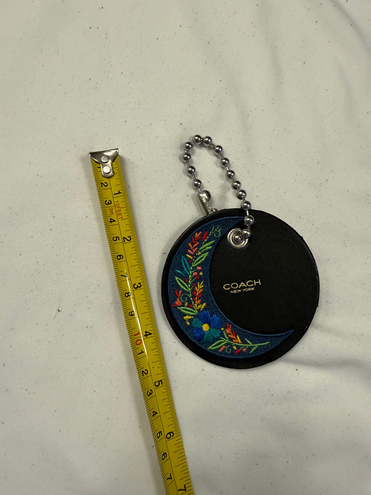 Repurposed Center of a Coach Coaster Holder with Embroidered Moon Patch and Large Ball Chain