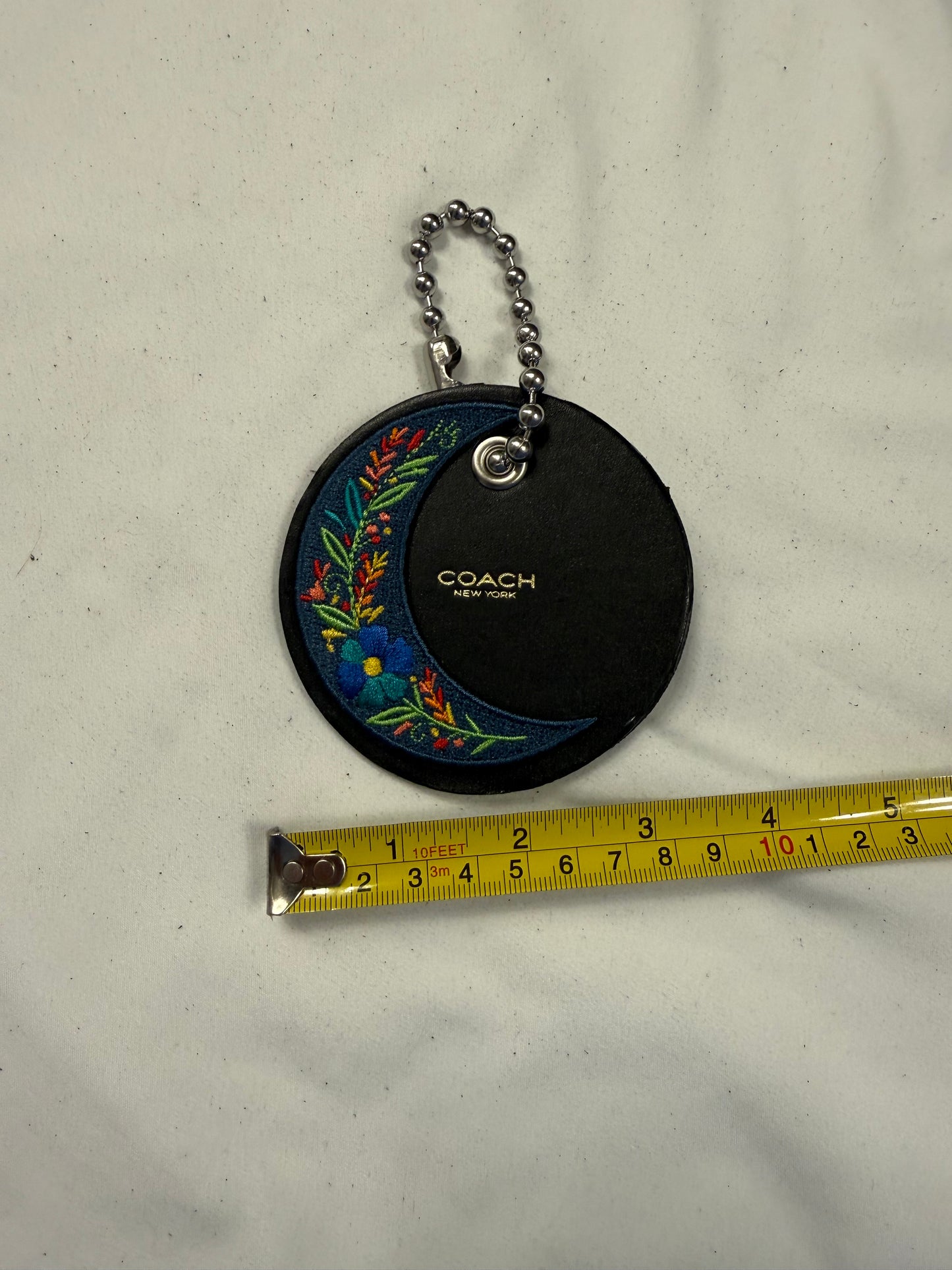 Repurposed Center of a Coach Coaster Holder with Embroidered Moon Patch and Large Ball Chain