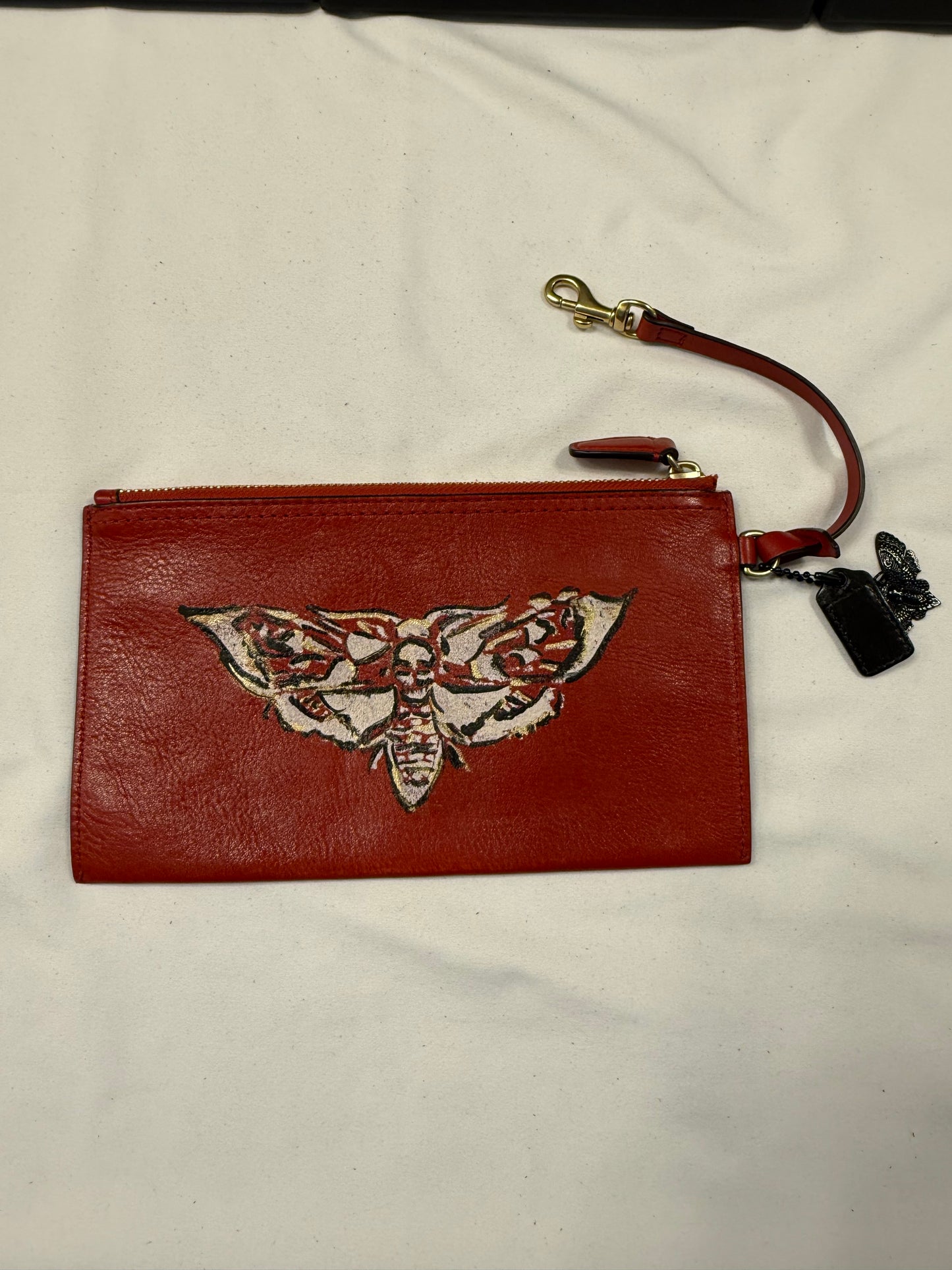 Upcrafted Coach Red Back Pouch with Gold Hardware Stenciled Skull Moth Painted and Mini Hagtag and Skull Moth Charm