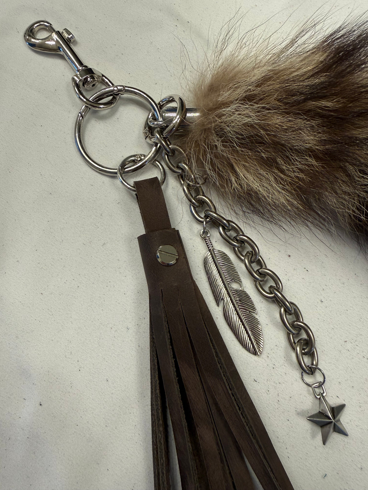 Cluster Bag Charm with Faux Fur Raccoon Tail, Handcut Leather Distressed Tassel, Gold Chain with Charms (the star is a Coach charm)