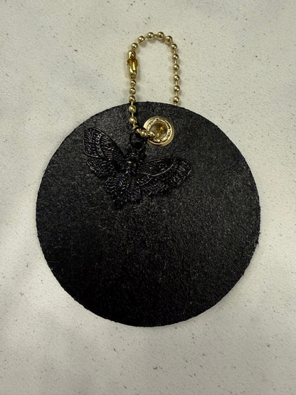 Stenciled and Painted Leather Disc with Butterfly and Skull Moth Charm