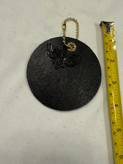 Stenciled and Painted Leather Disc with Butterfly and Skull Moth Charm
