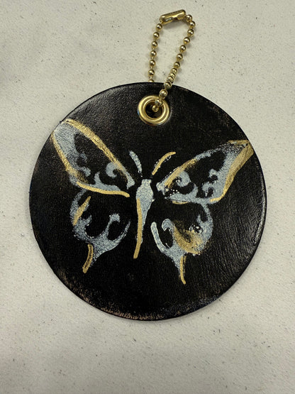 Stenciled and Painted Leather Disc with Butterfly and Skull Moth Charm