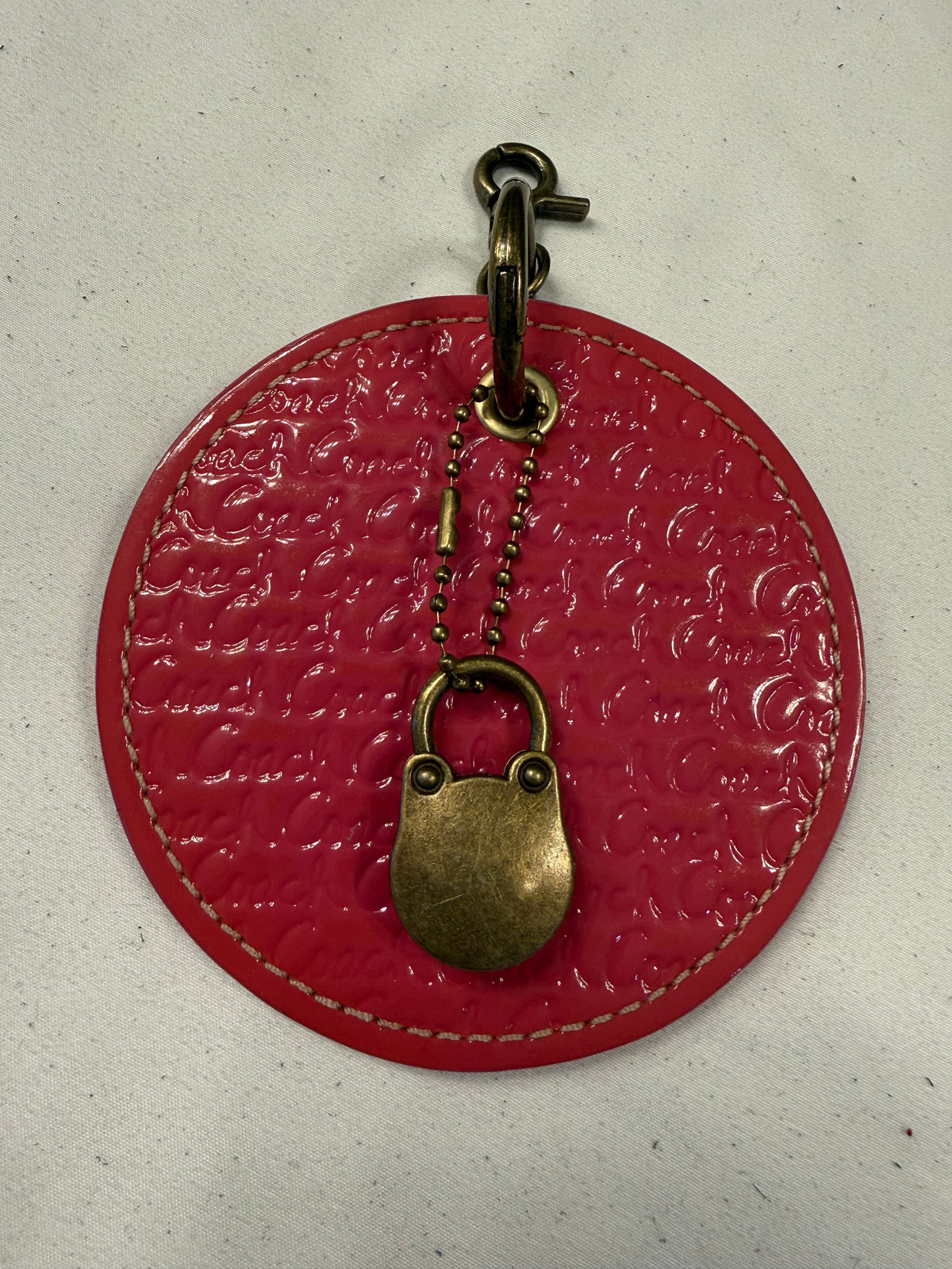 Repurposed Coach 1990s Coaster with Lock Bag Charm
