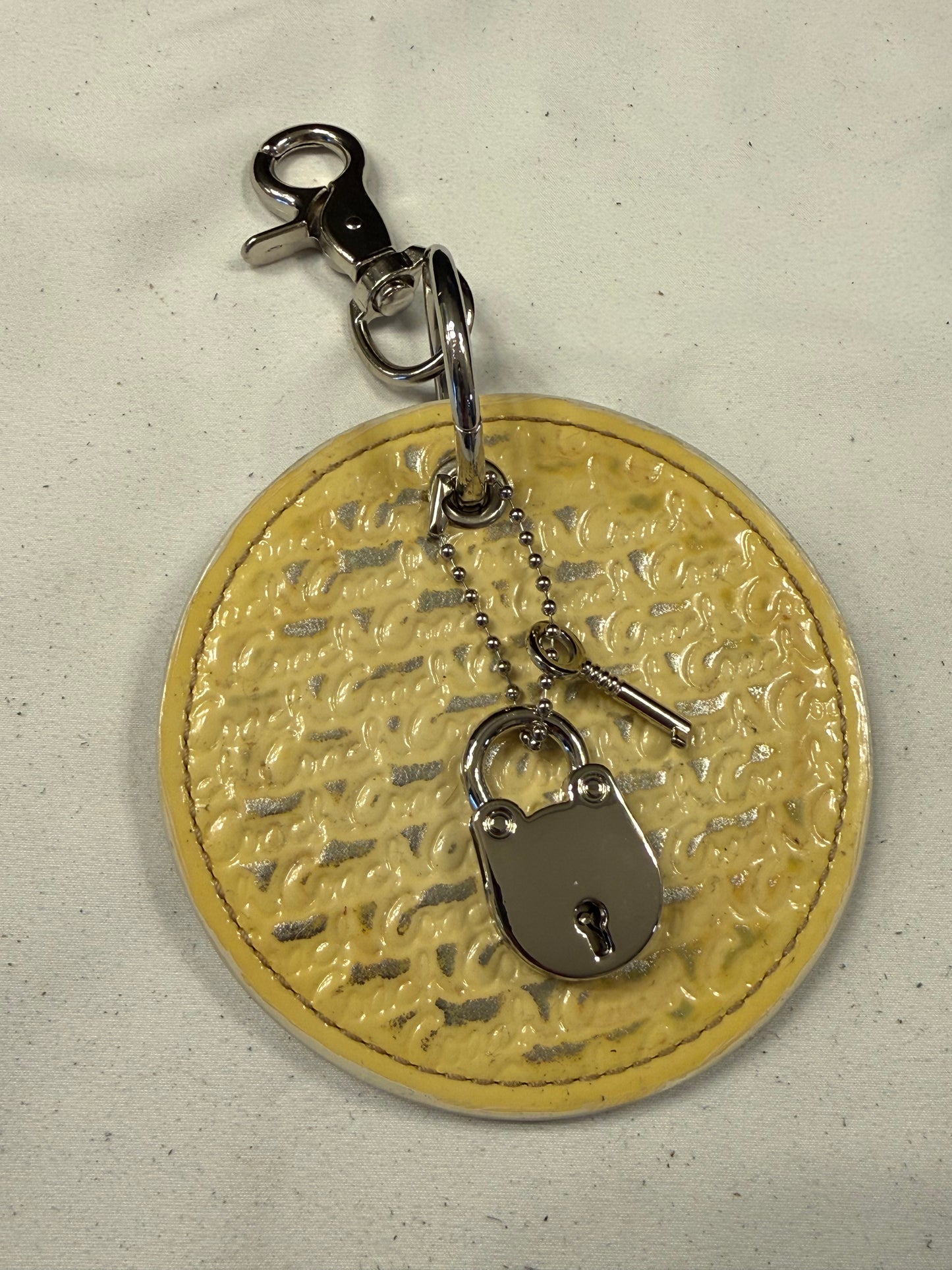 Repurposed Coach 1990s Coaster with Lock and Key Charm (works) Bag Charm