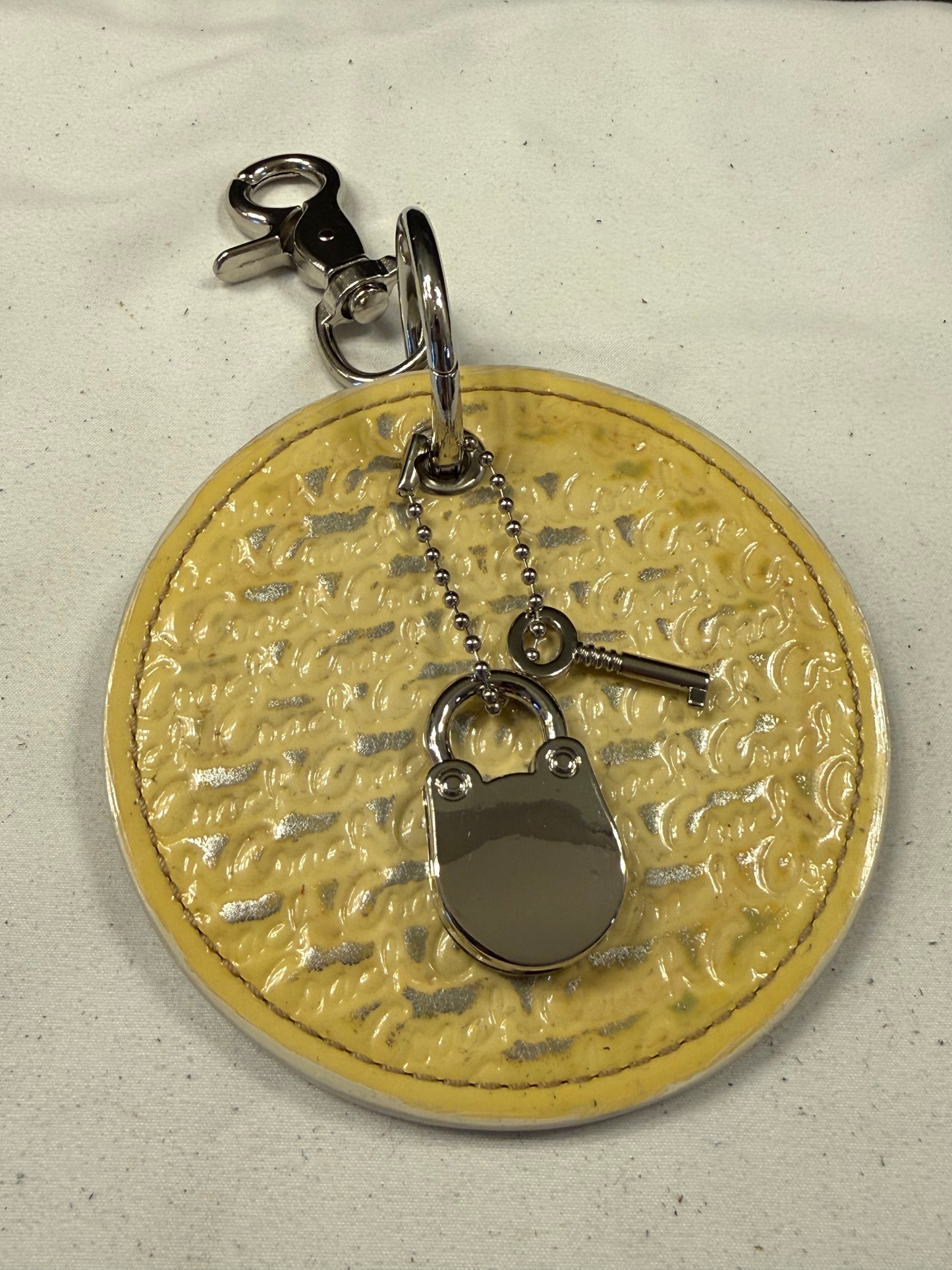 Repurposed Coach 1990s Coaster with Lock and Key Charm (works) Bag Charm