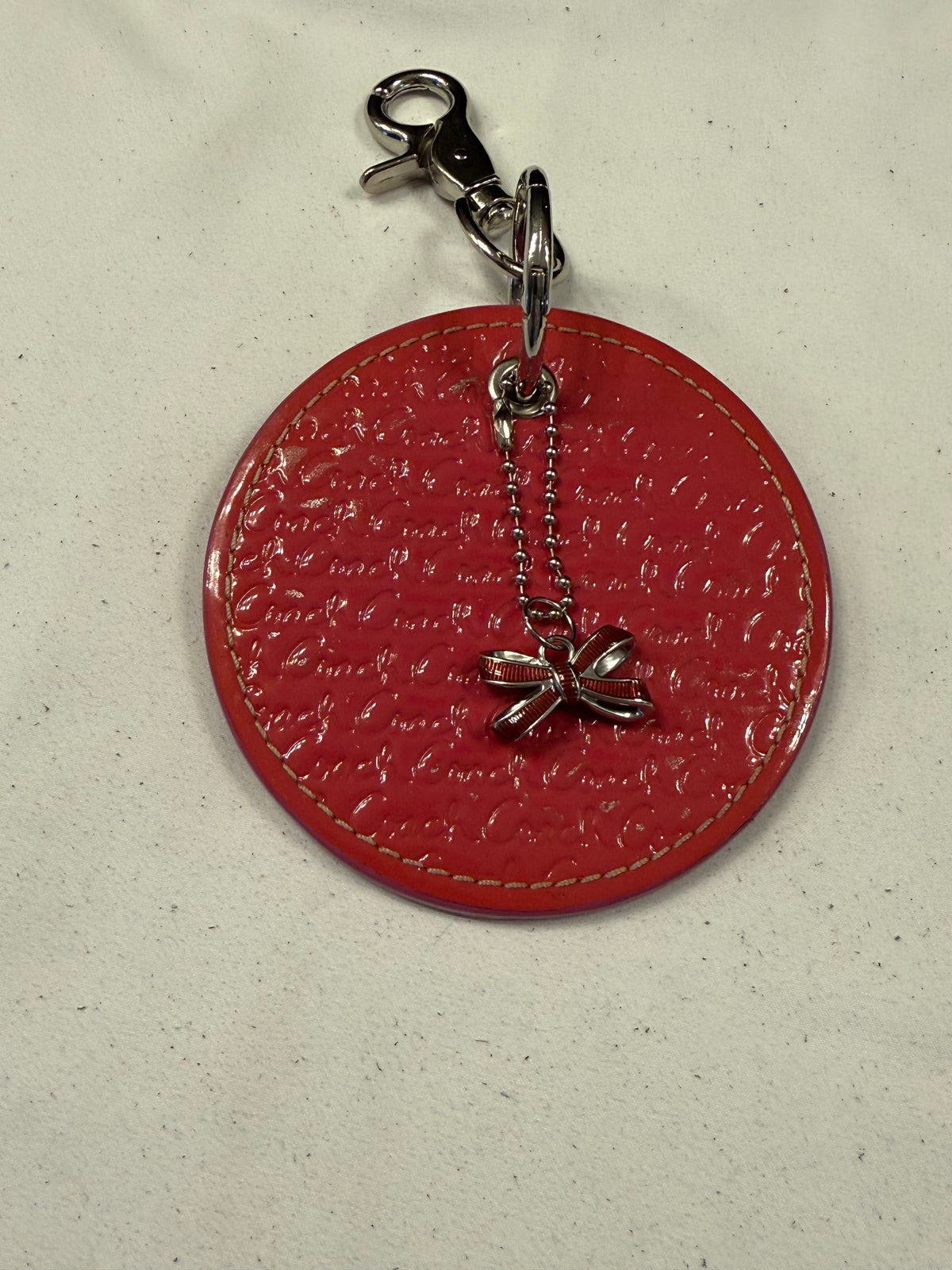 Repurposed Coach 1990s Coaster with Coach Bow Charm Bag Charm