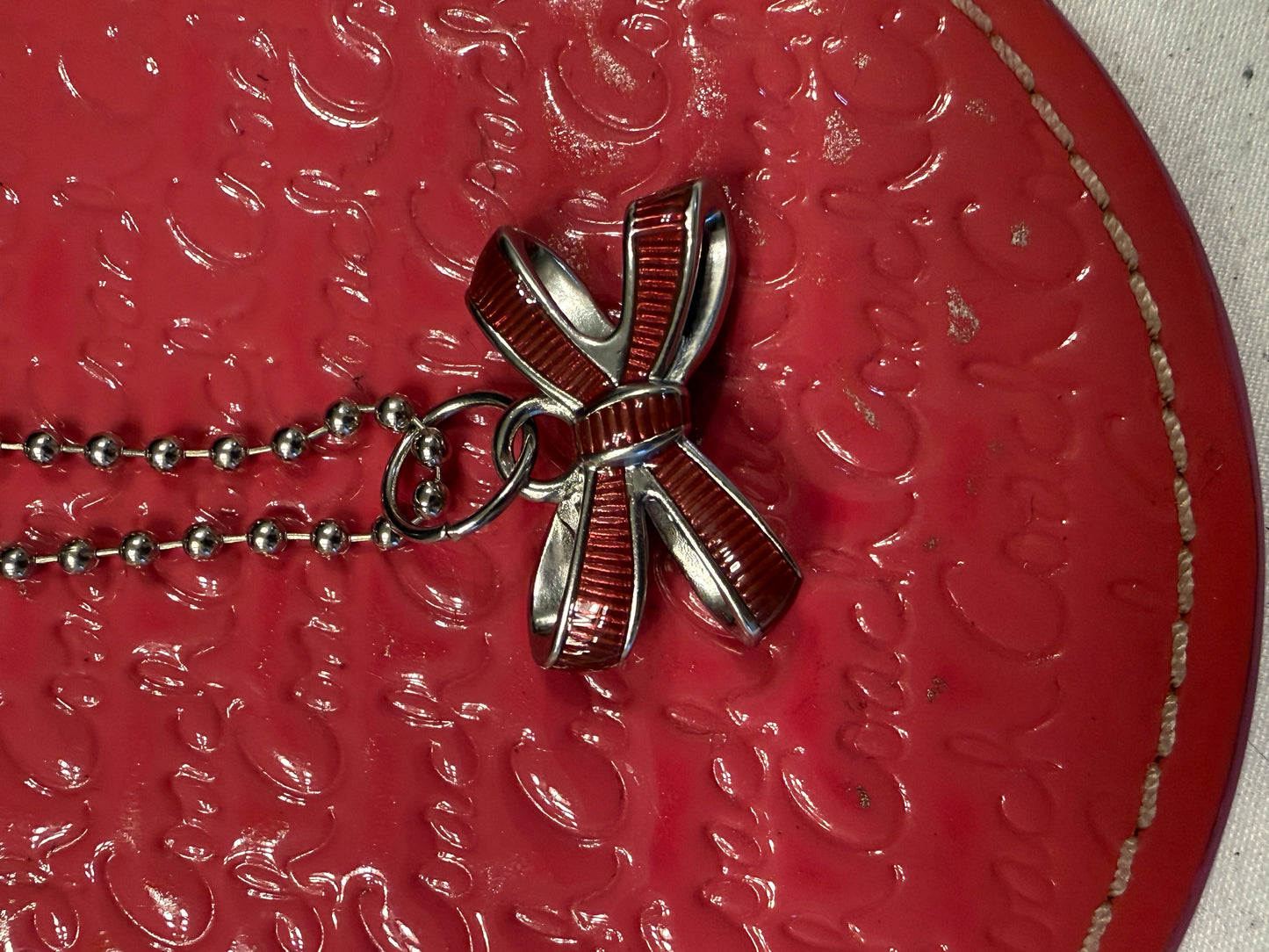Repurposed Coach 1990s Coaster with Coach Bow Charm Bag Charm