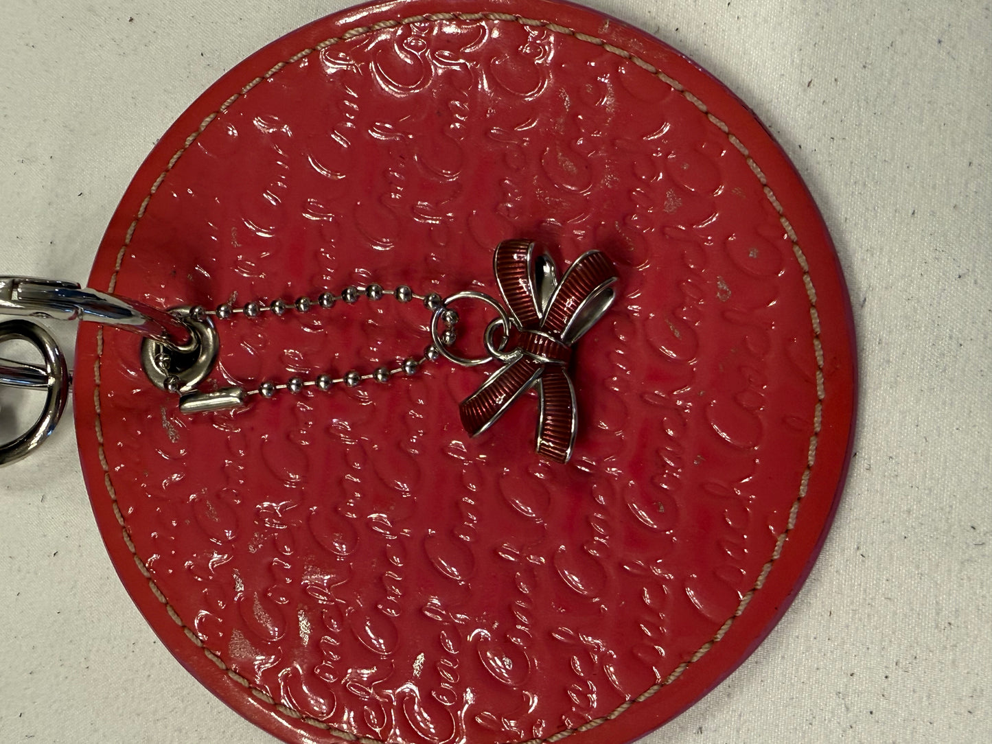 Repurposed Coach 1990s Coaster with Coach Bow Charm Bag Charm