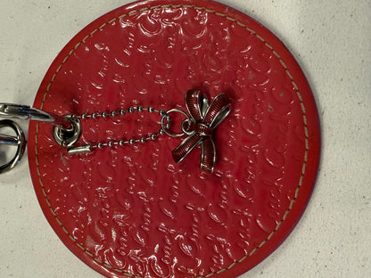Repurposed Coach 1990s Coaster with Coach Bow Charm Bag Charm