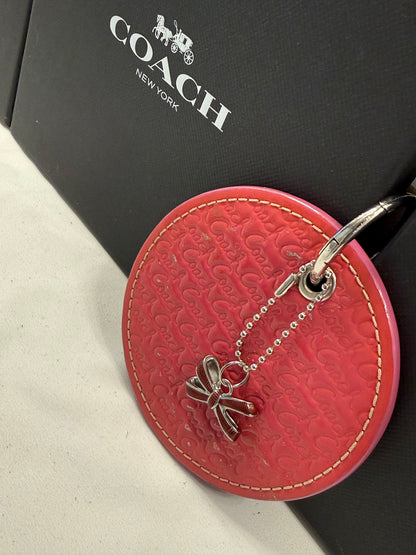 Repurposed Coach 1990s Coaster with Coach Bow Charm Bag Charm