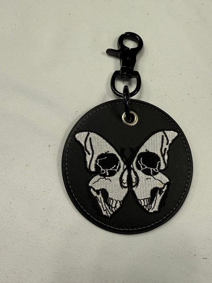 Repurposed Coach Coaster with Skull Butterfly Embroidered Patch Bag Charm Black Hardware