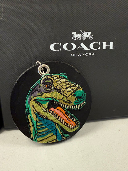 Repurposed Center of a Coach Coaster with T-Rex Embroidered Patch Bag Charm Silver Hardware