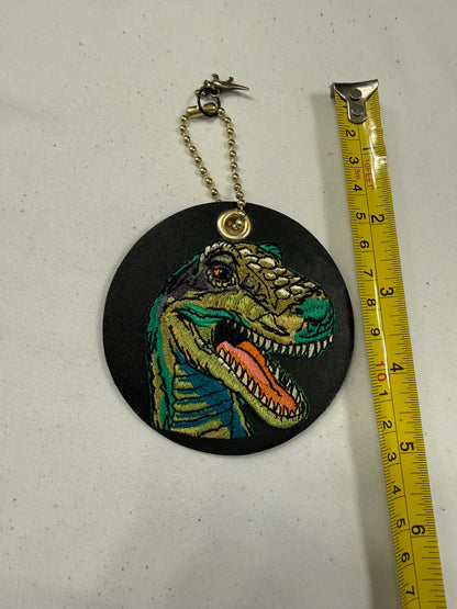 Repurposed Center of a Coach Coaster with Embroidered T-Rex Patch Bag Charm