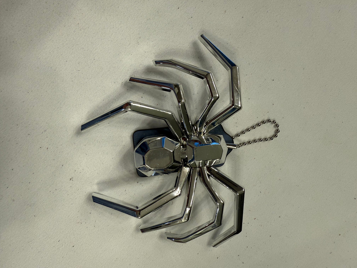 Repurposed Coach Blue Hangtag Bag Charm with Metallic Plastic Spider Emblem