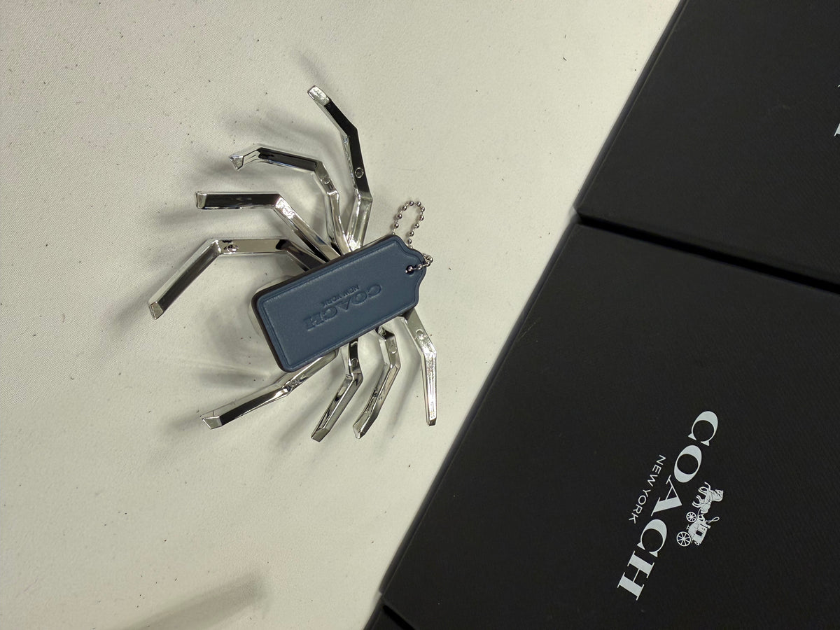 Repurposed Coach Blue Hangtag Bag Charm with Metallic Plastic Spider Emblem