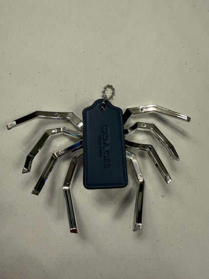 Repurposed Coach Blue Hangtag Bag Charm with Metallic Plastic Spider Emblem