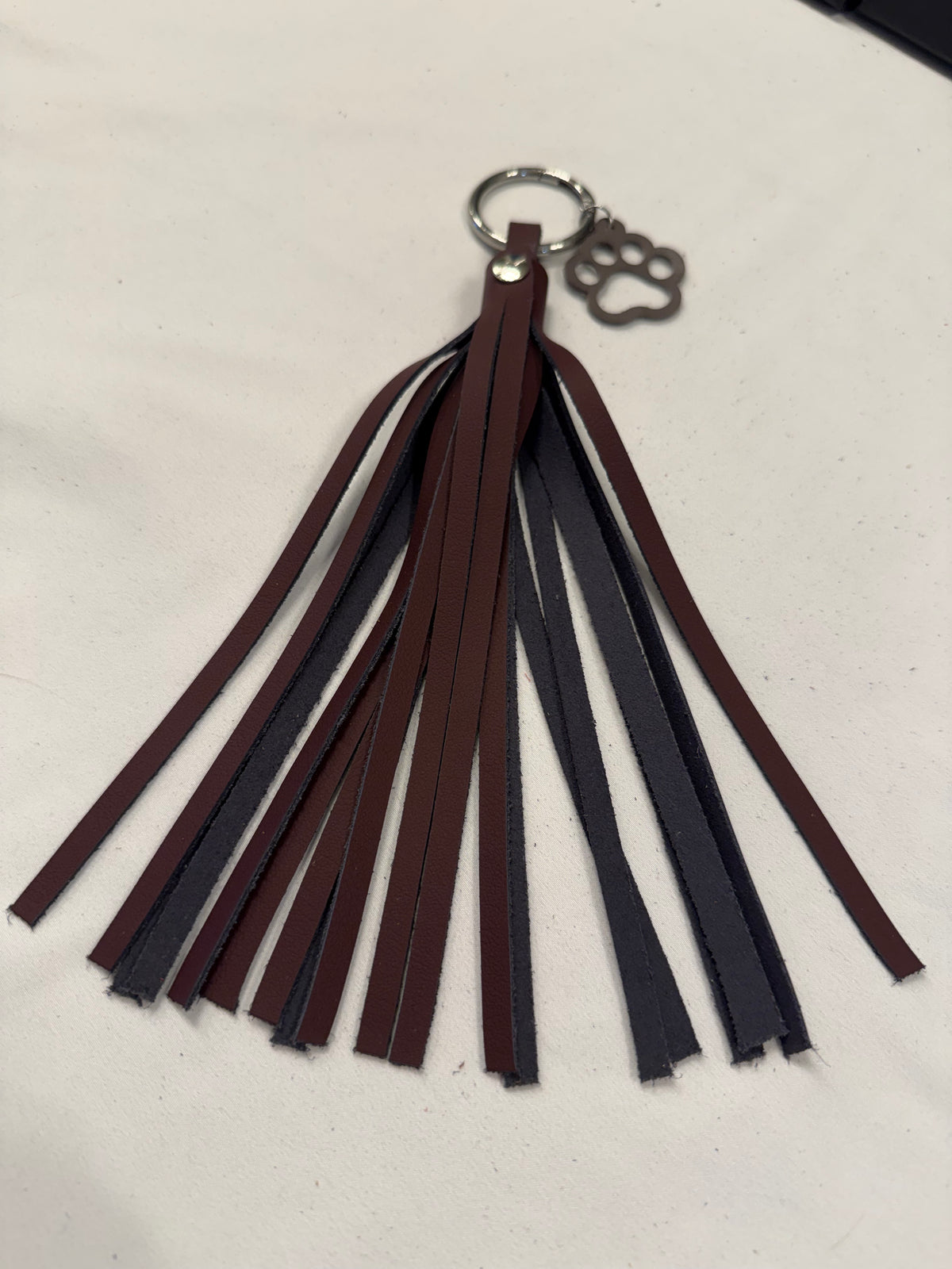 Handcut Two-Tone Leather Tassel with Leather Paw Print Charm