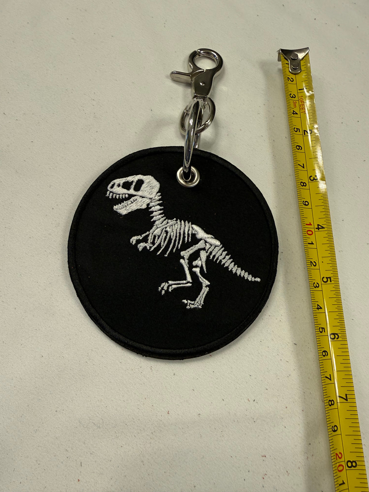 Repurposed Piece of a Coach Handbag with T-Rex Skeleton Patch Bag Charm