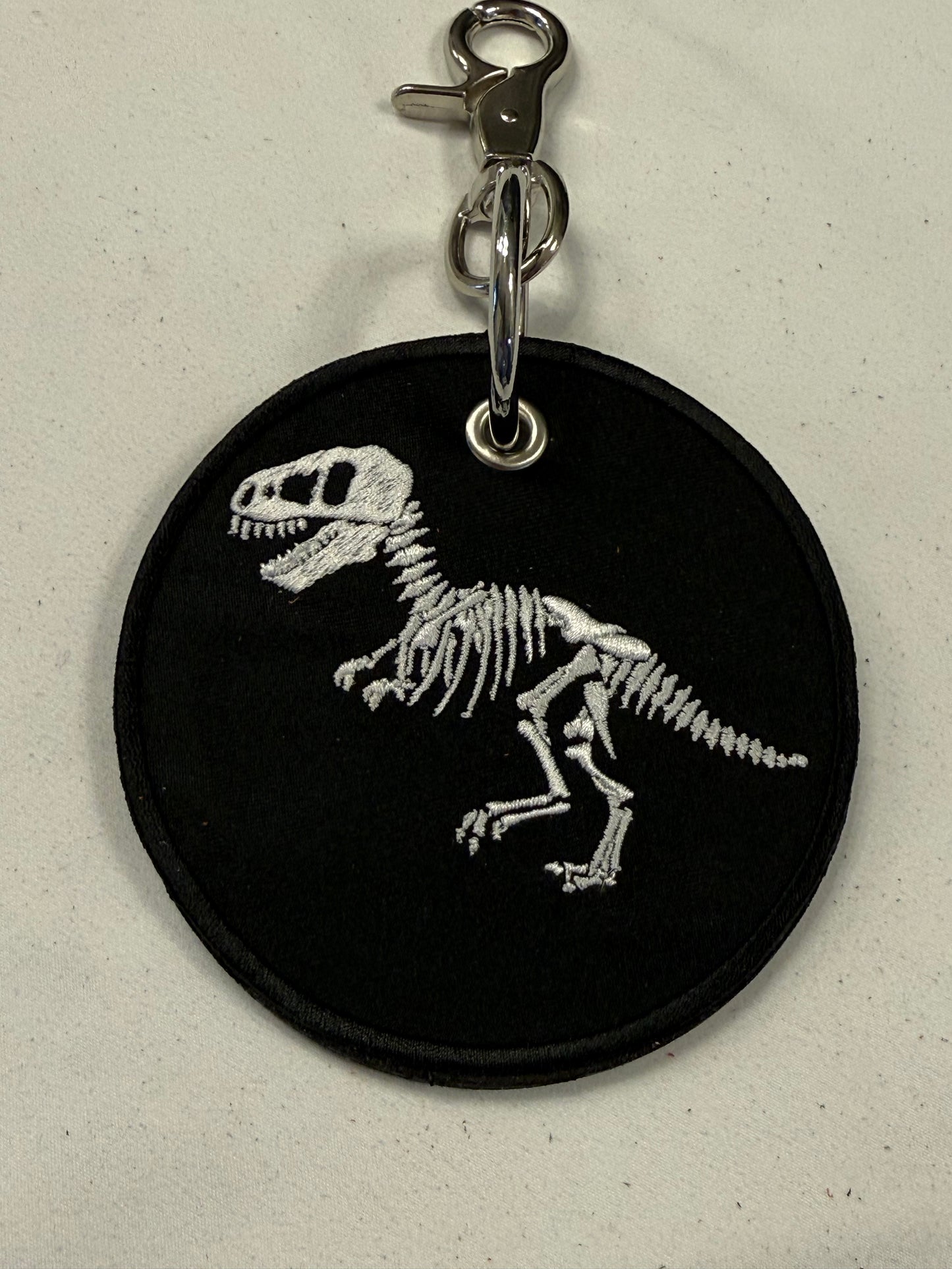 Repurposed Piece of a Coach Handbag with T-Rex Skeleton Patch Bag Charm
